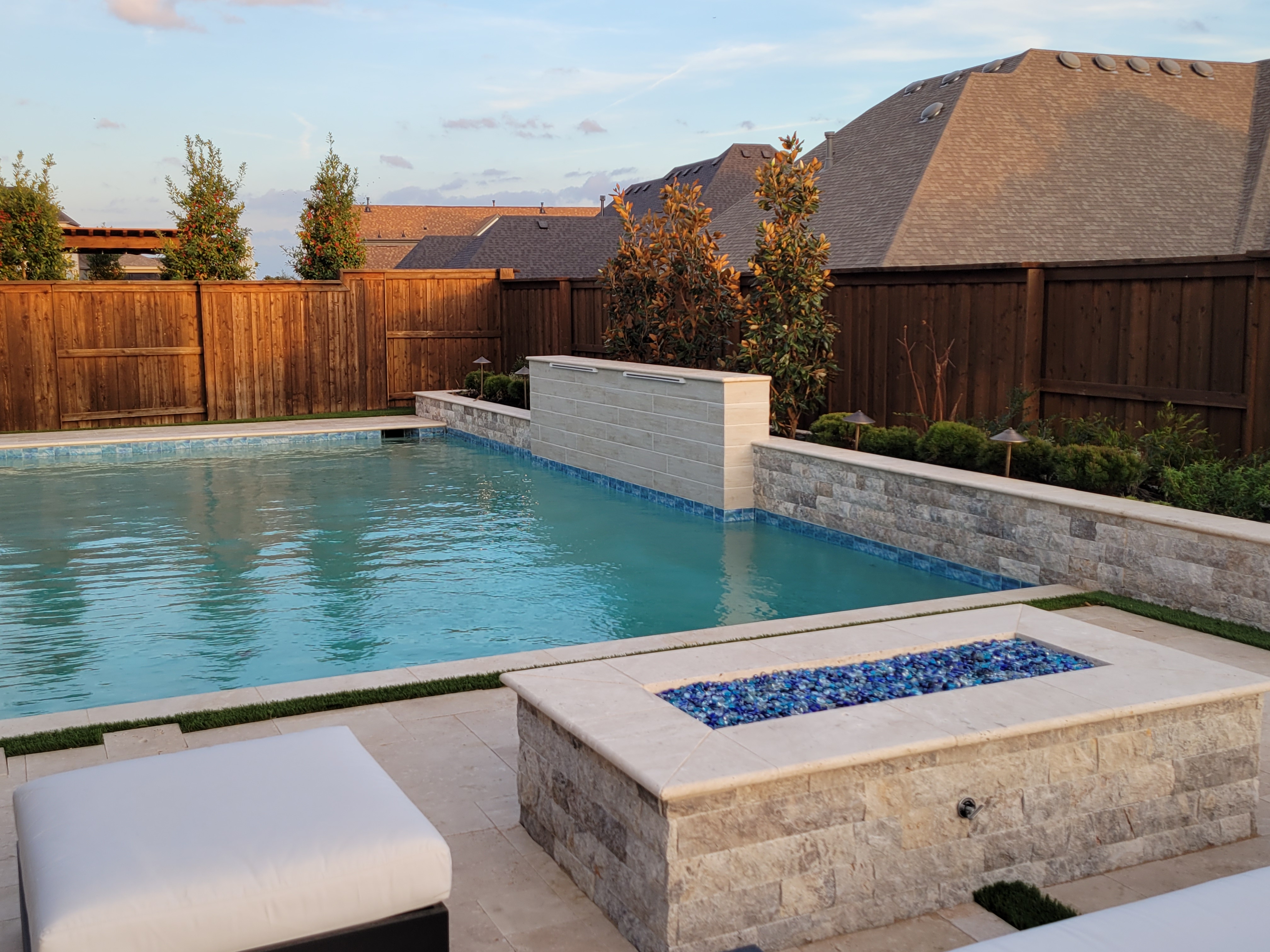 Completed pool environment and covered outdoor living in Colleyville, Texas — Nova Luxe Homes